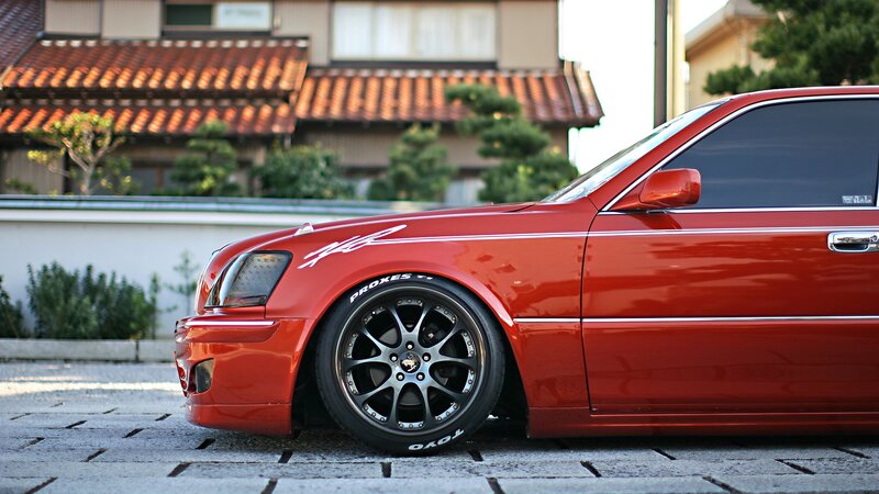 Red Modified Sedan — Calm, Afternoon, Photograph