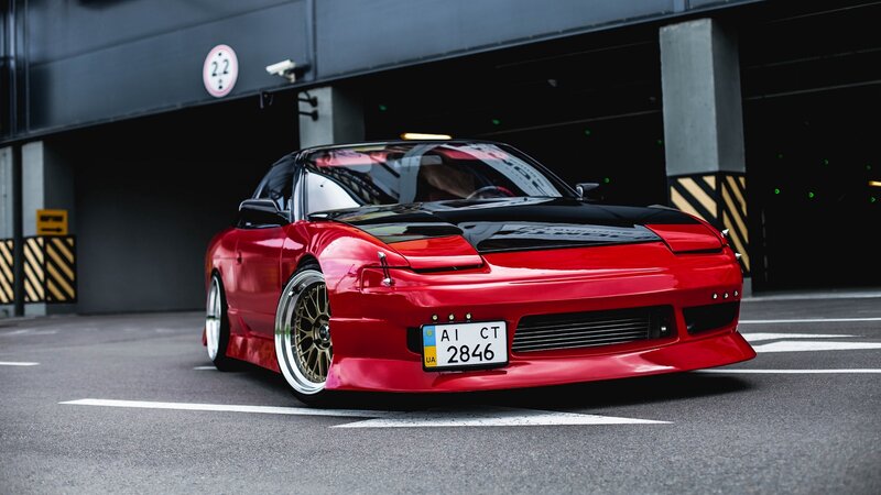 Red Modified Sports Car — Dramatic, Photograph, Parking Garage