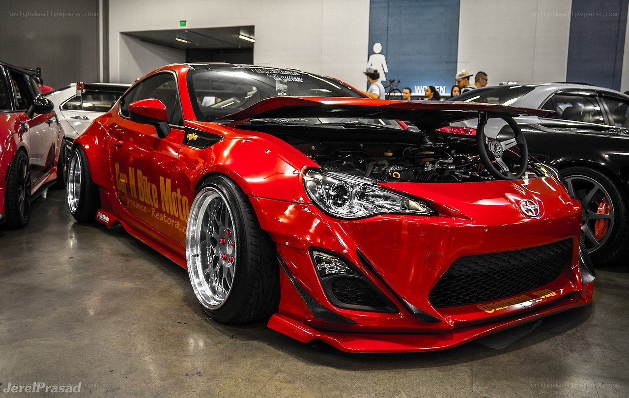 Red modified sports car on display