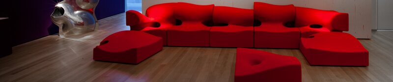 Red modular sofa in gallery