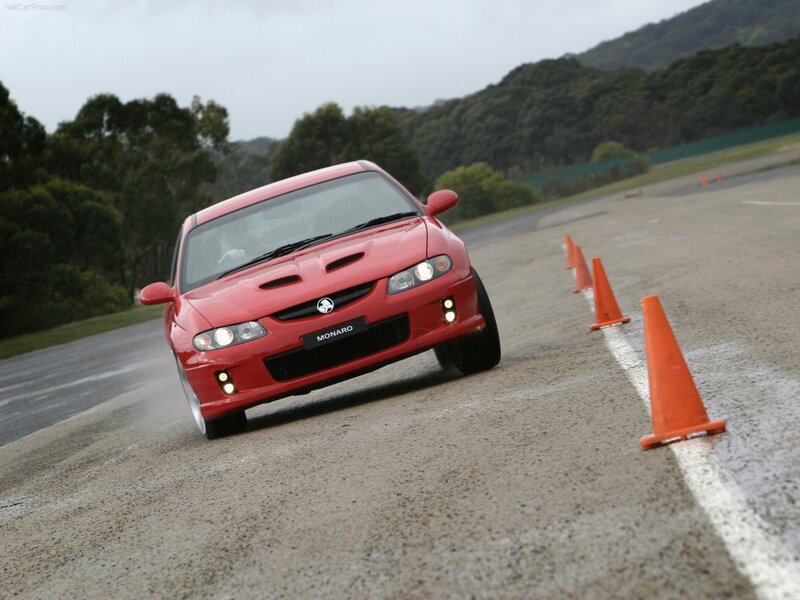 Red Monaro on a racetrack