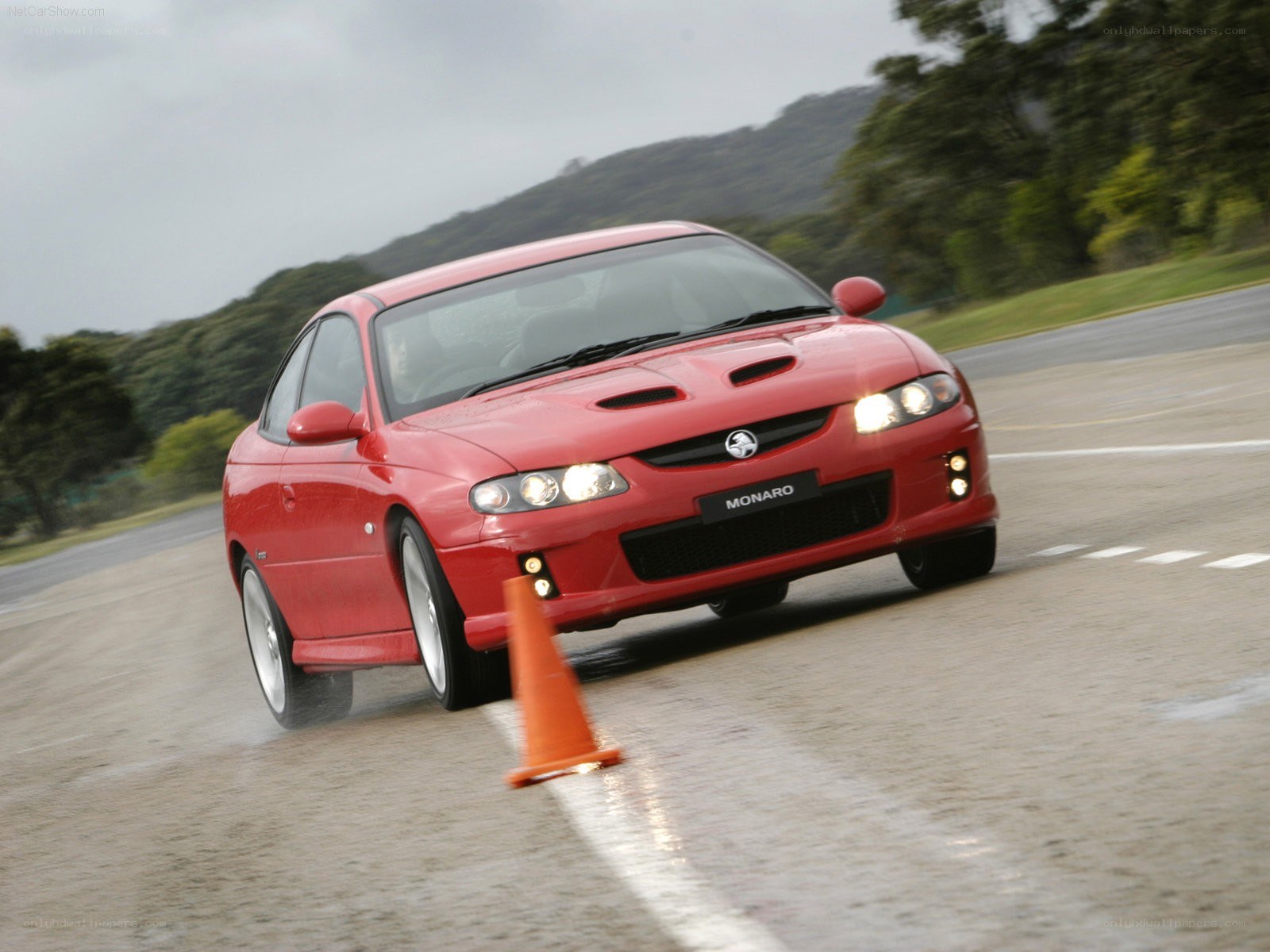 Red Monaro on a wet track
