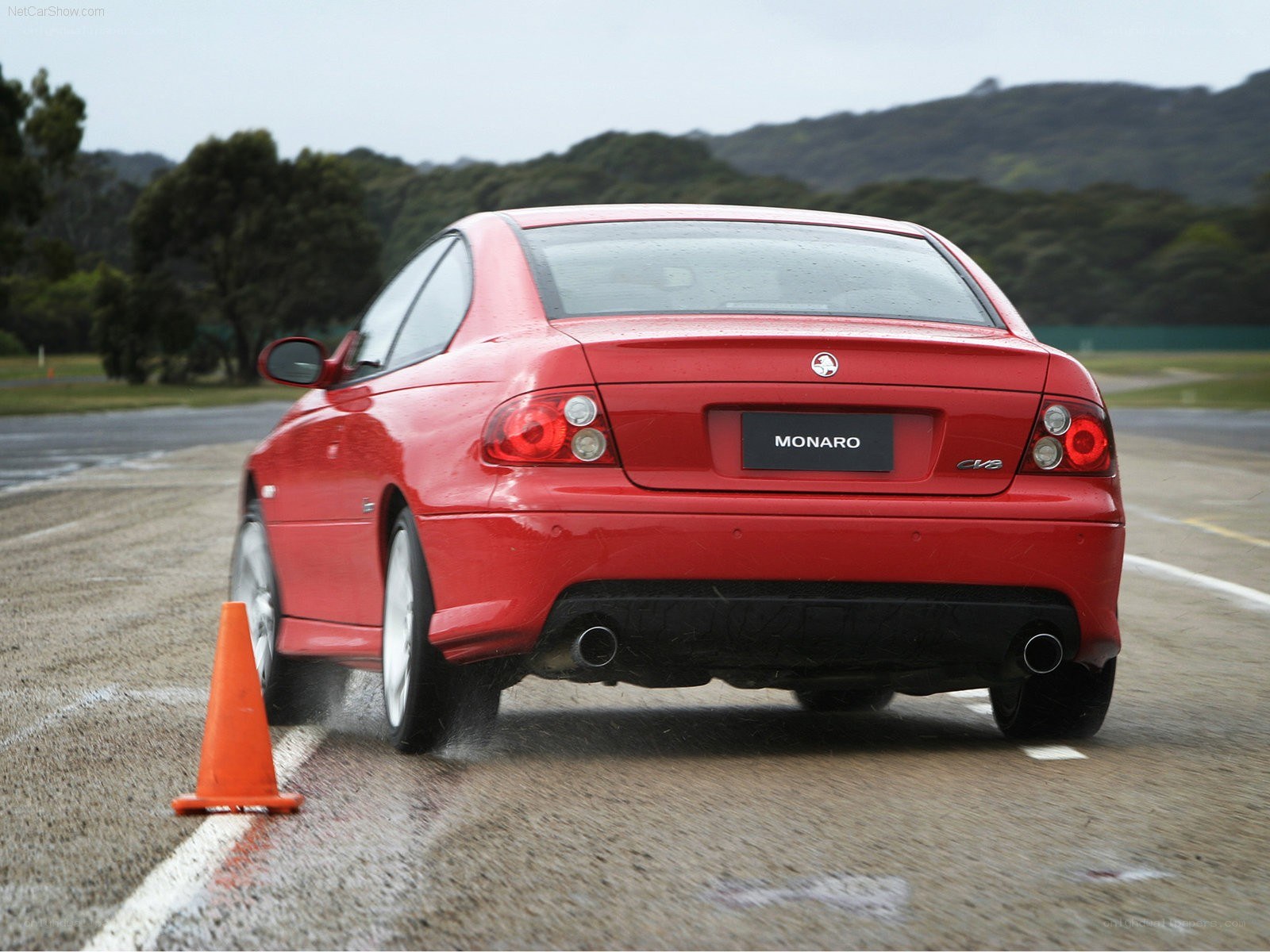 Red Monaro on wet track
