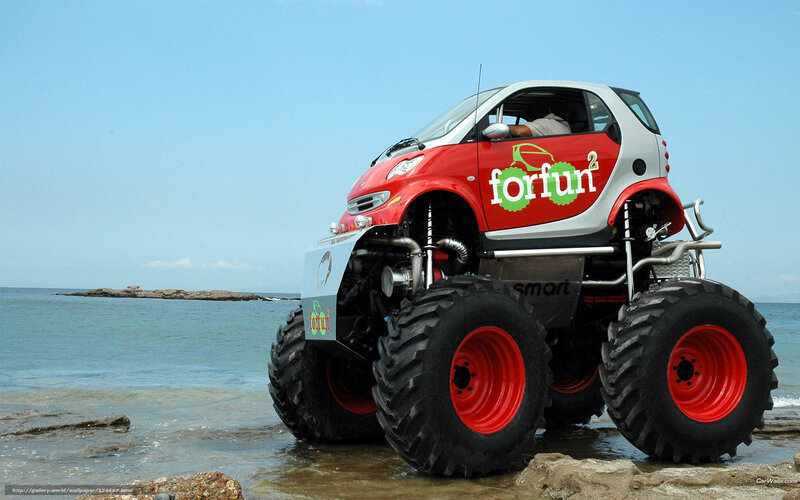 Red monster car on beach