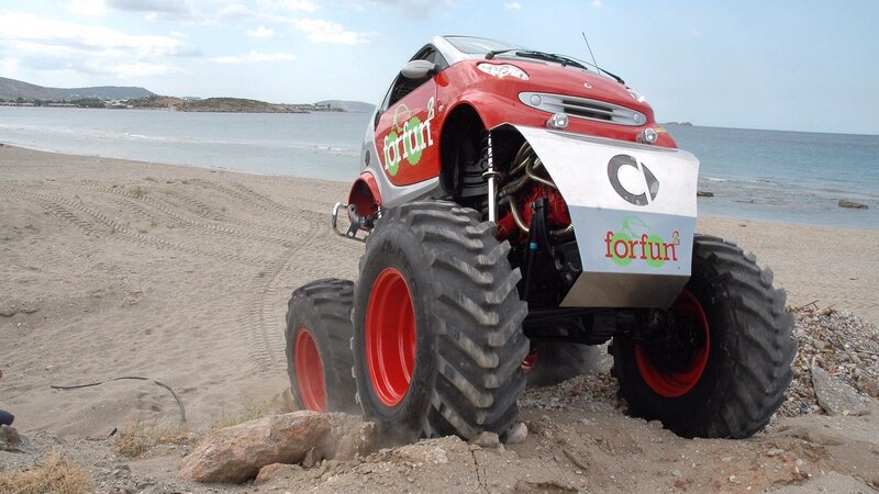 red monster truck on beach