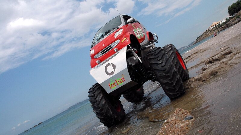 Red monster truck on beach