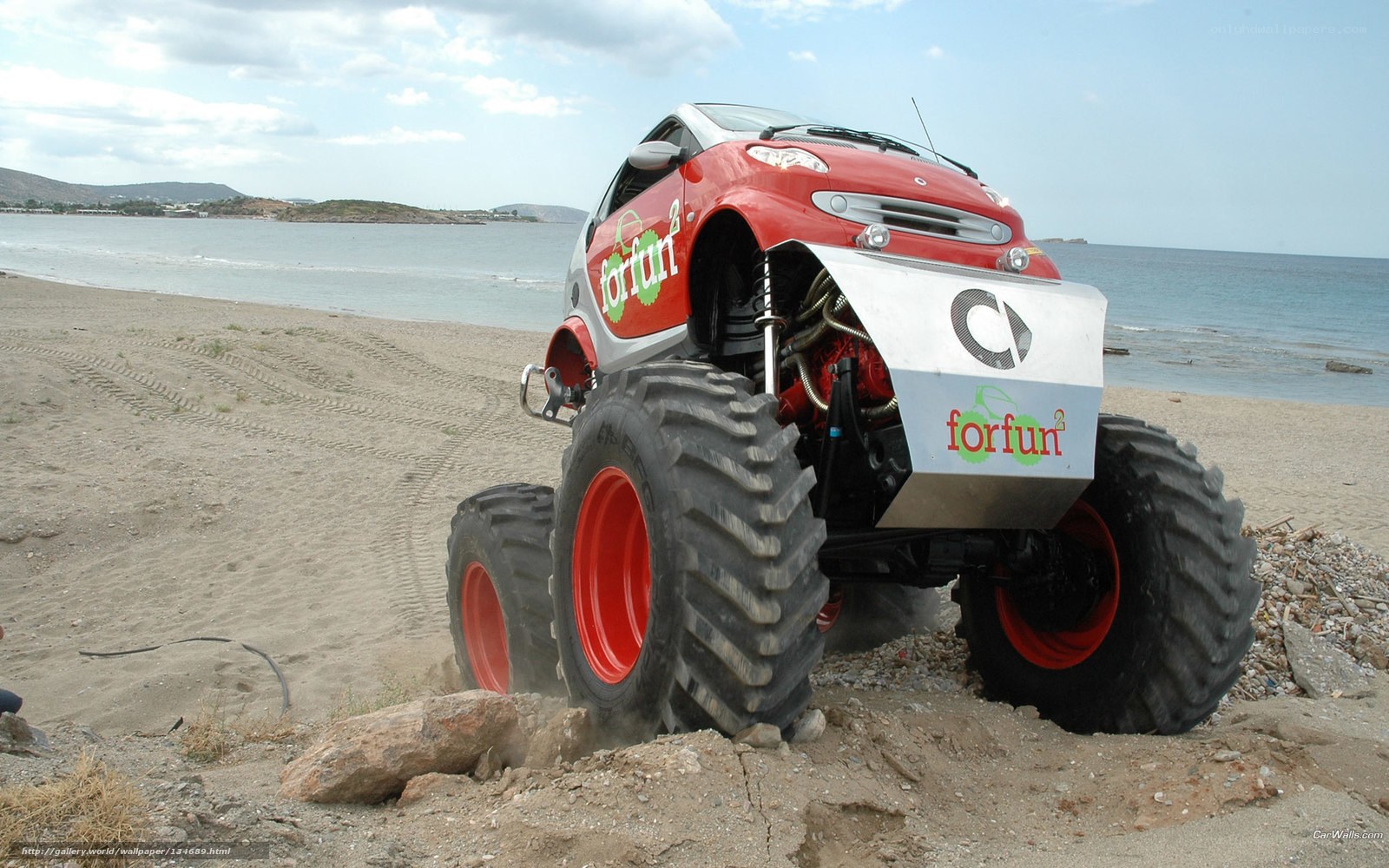 Red monster truck on beach