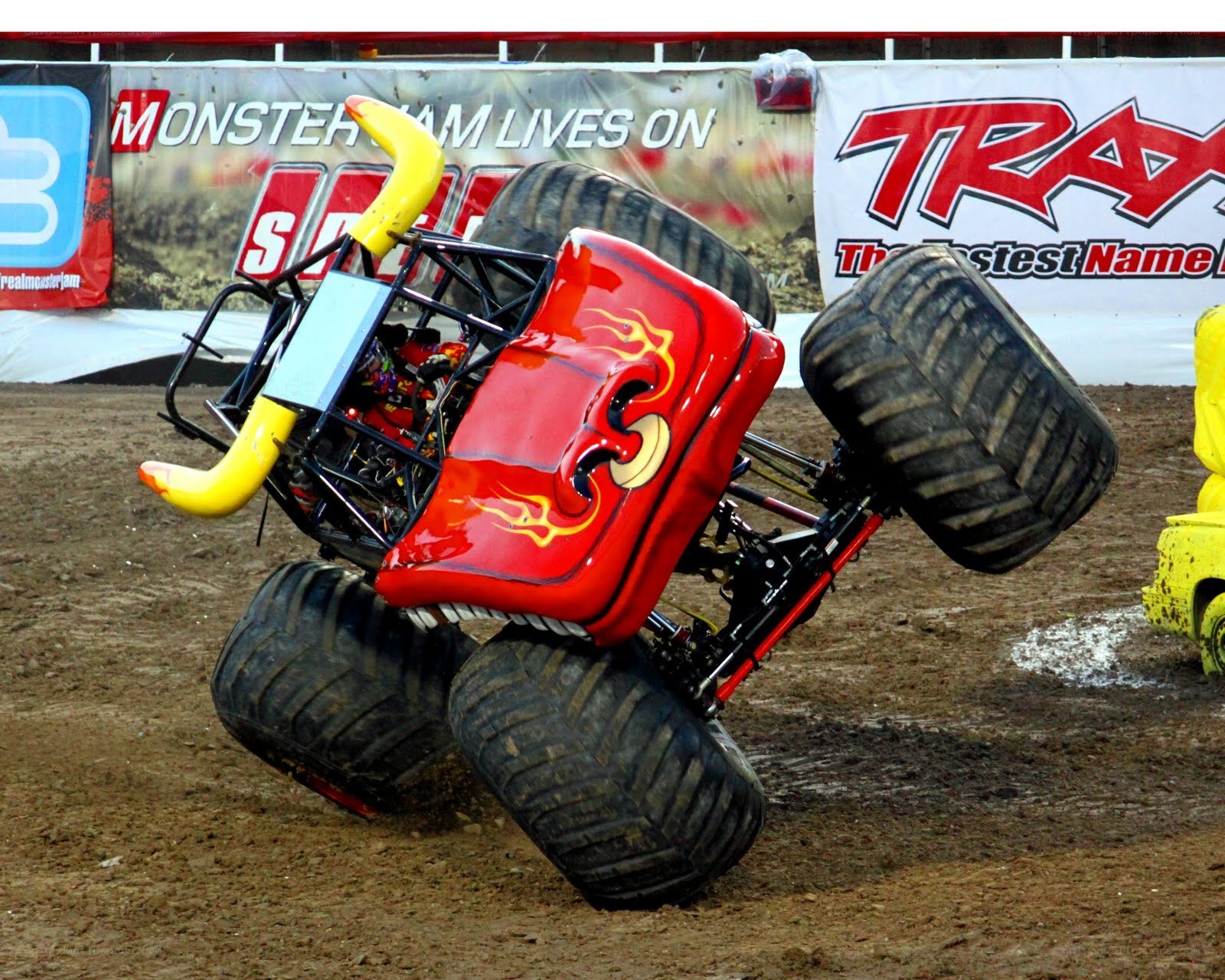 Red monster truck performing stunt