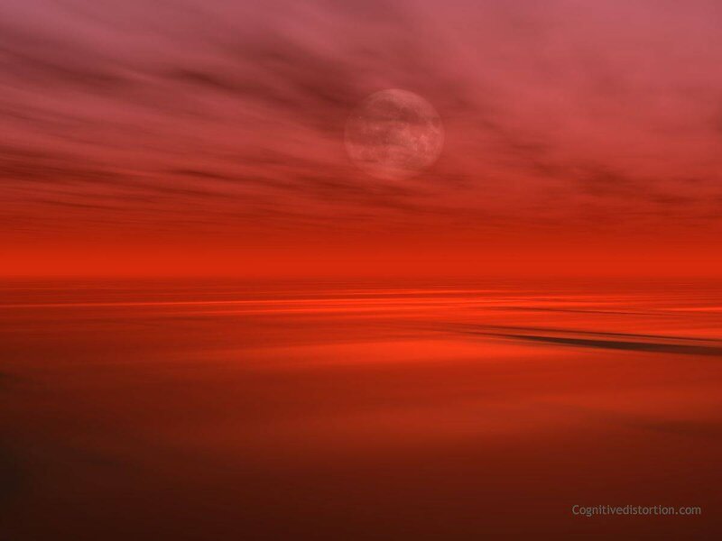 Red moon over ocean