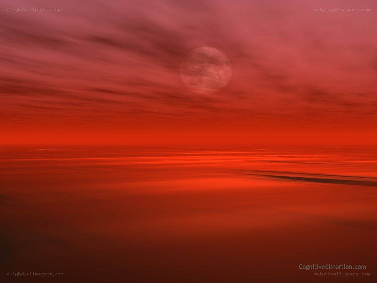 Red moon over ocean