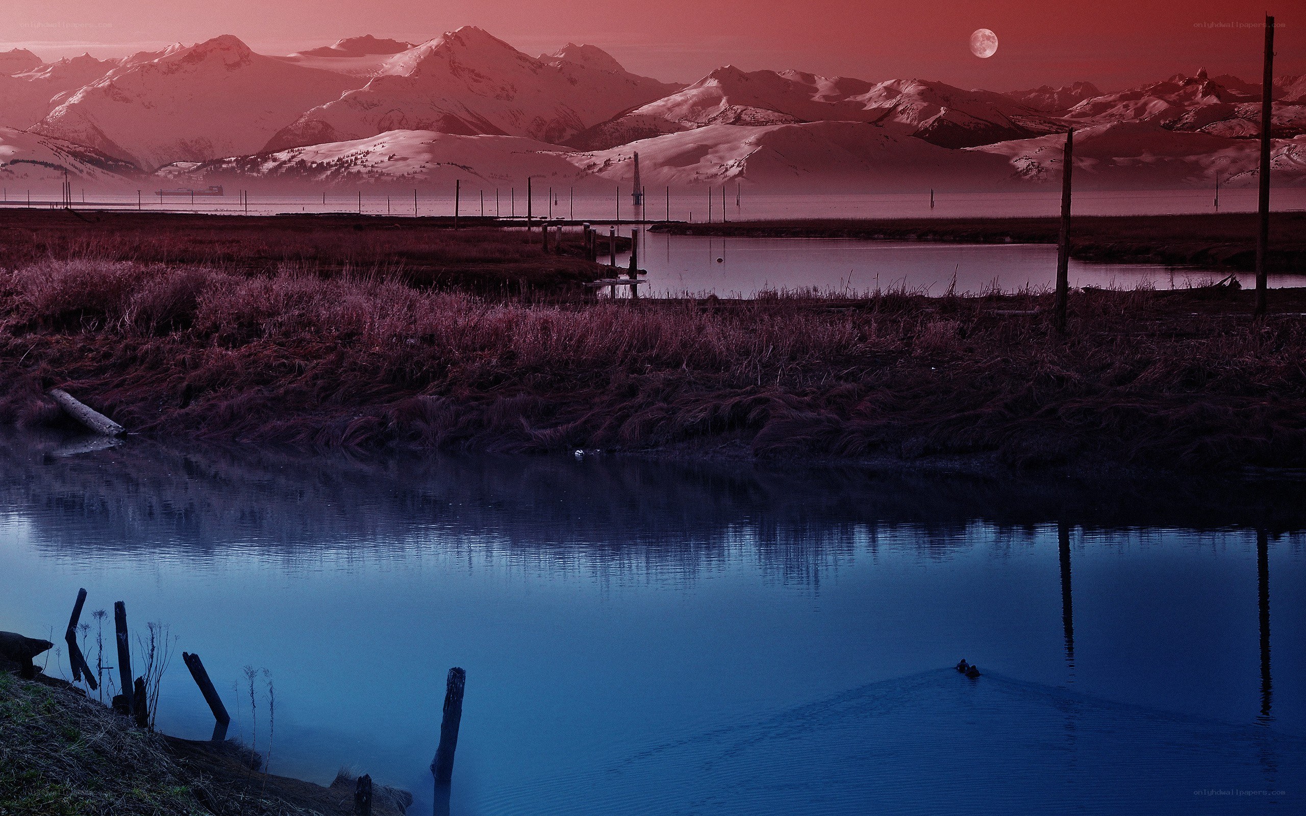 Red Moon Over Snowy Mountains