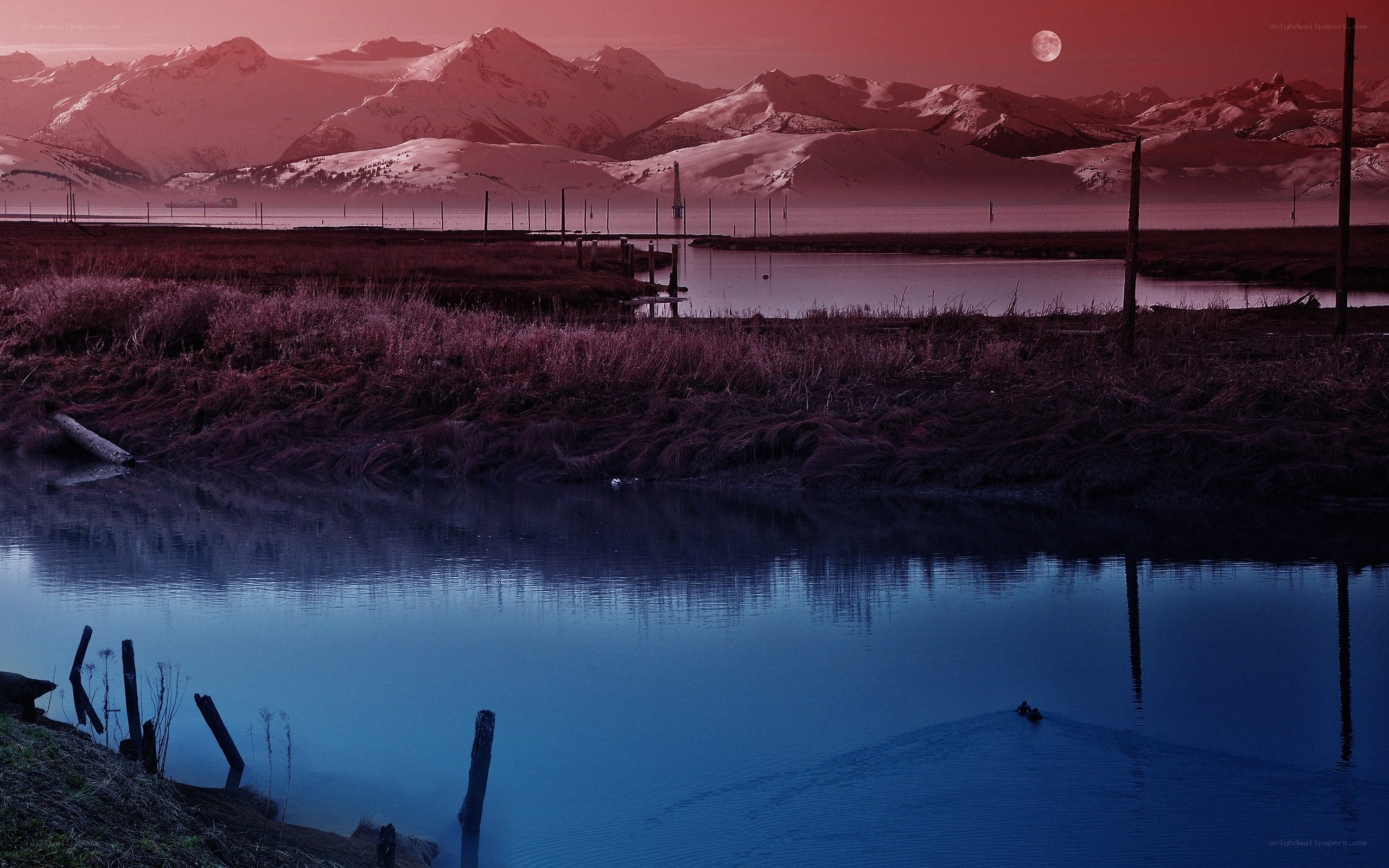 Red Moon Over Snowy Mountains