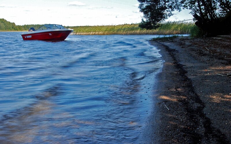 Red Motorboat on Lake