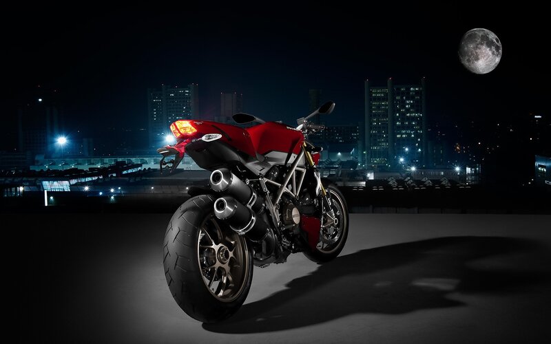 Red motorcycle at night