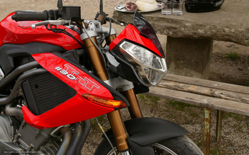 Red motorcycle at picnic table