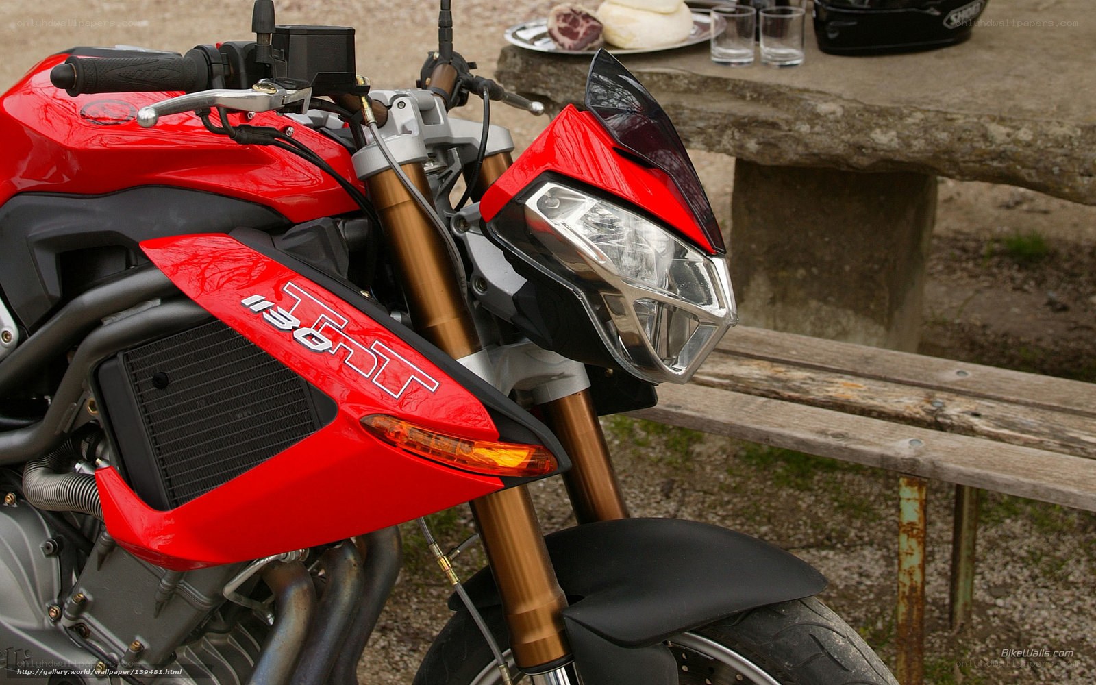 Red motorcycle at picnic table