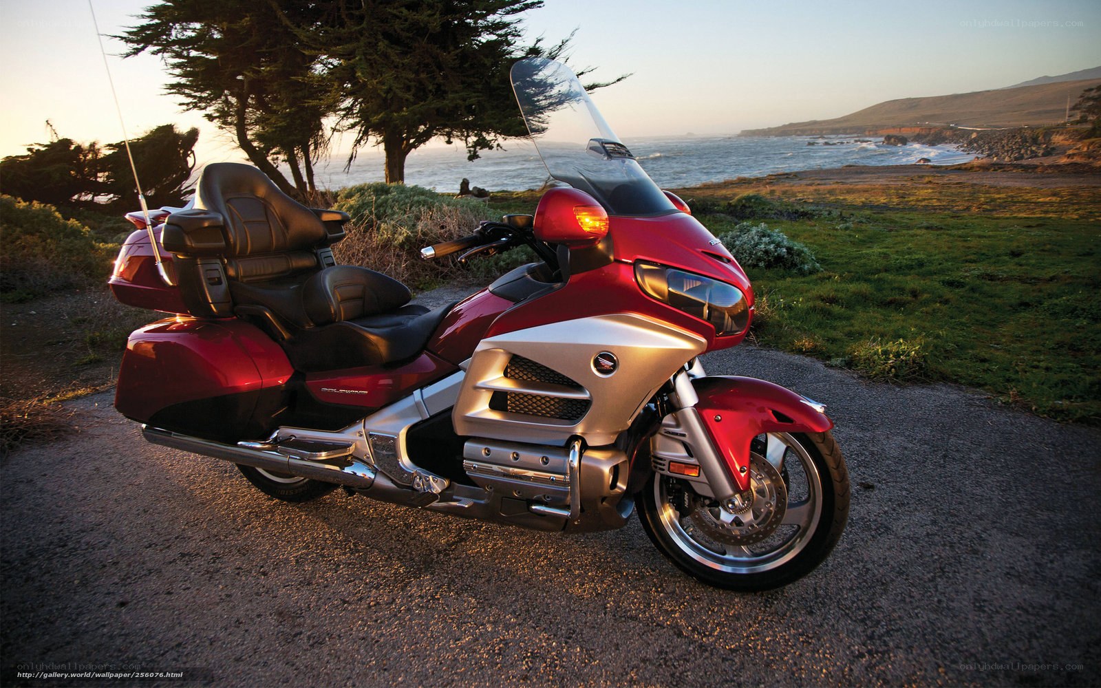 Red motorcycle by the ocean