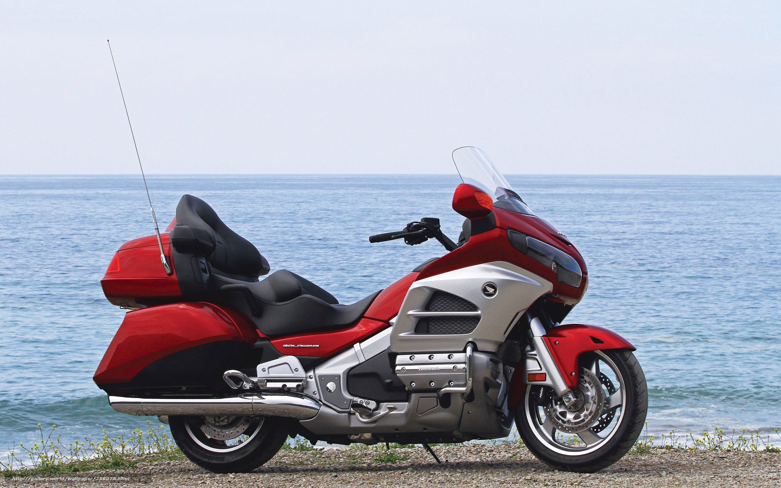 Red motorcycle by the sea