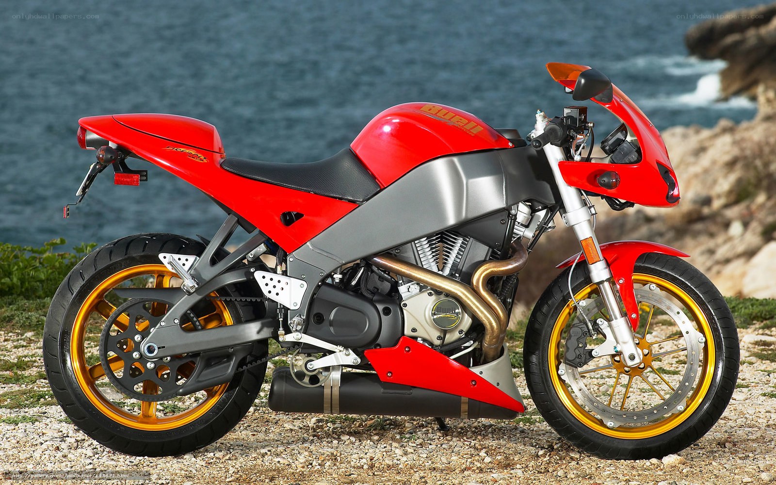 Red motorcycle by the sea