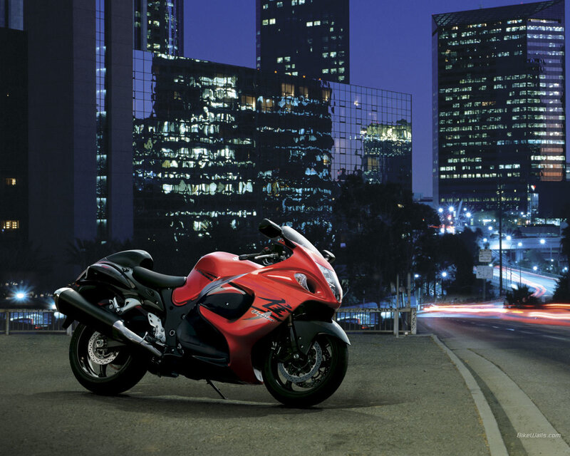 Red motorcycle in city at night