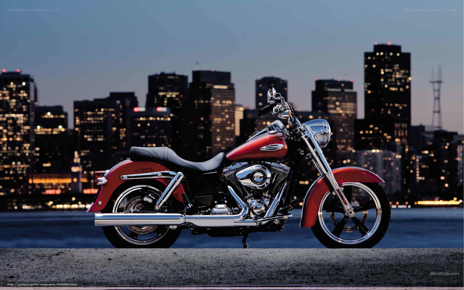 Red motorcycle in cityscape