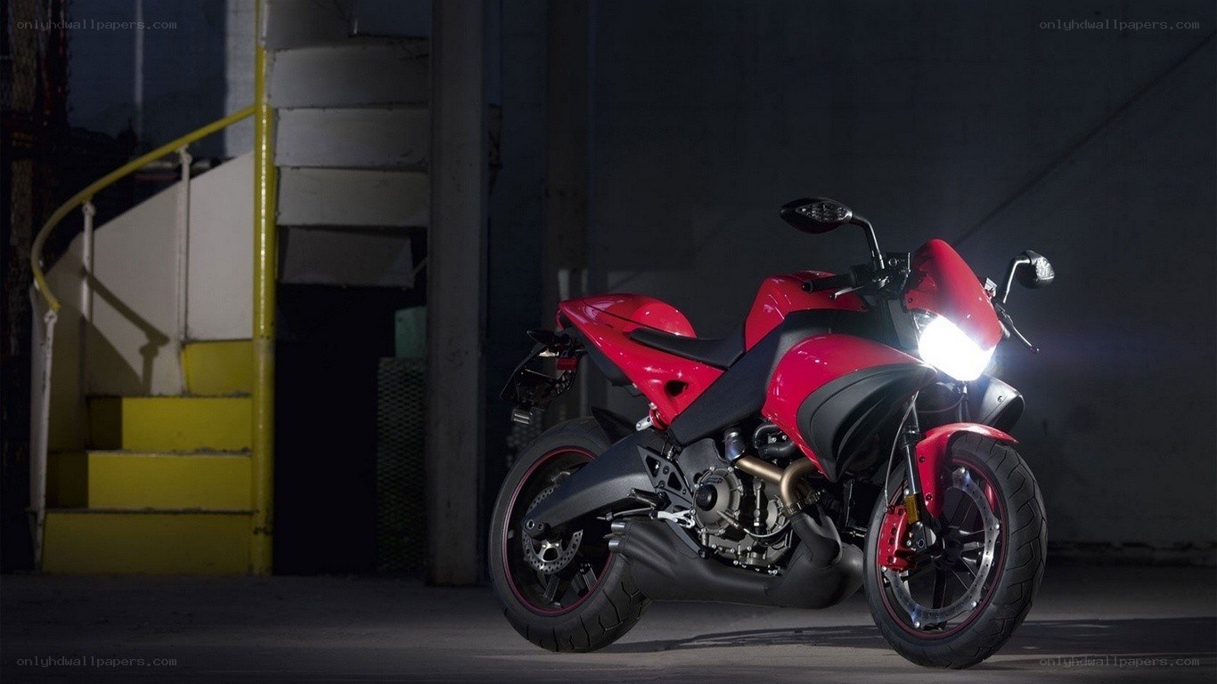 red motorcycle in dark garage