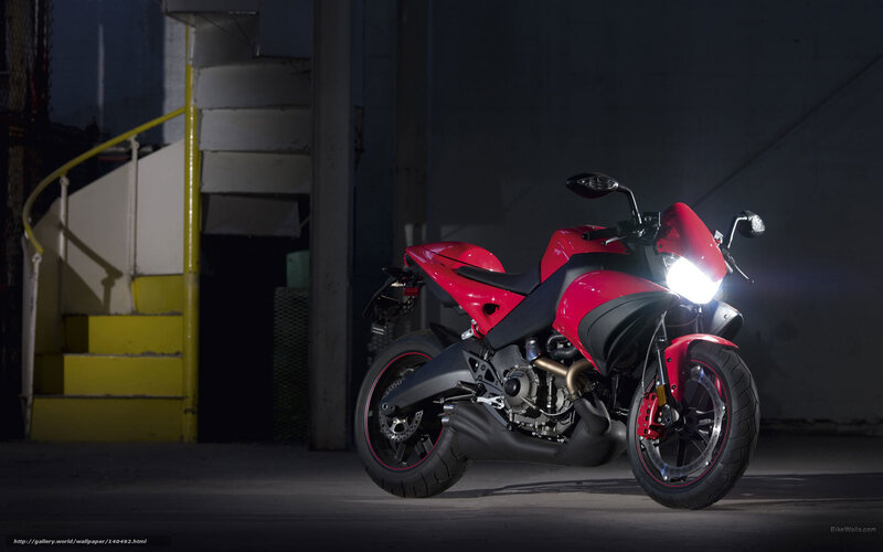 Red motorcycle in dark garage