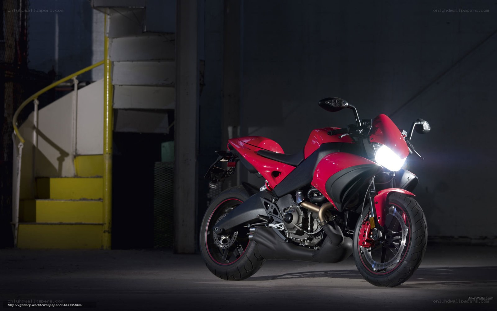 Red motorcycle in dark garage
