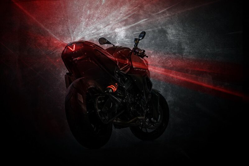 Red motorcycle in dramatic lighting
