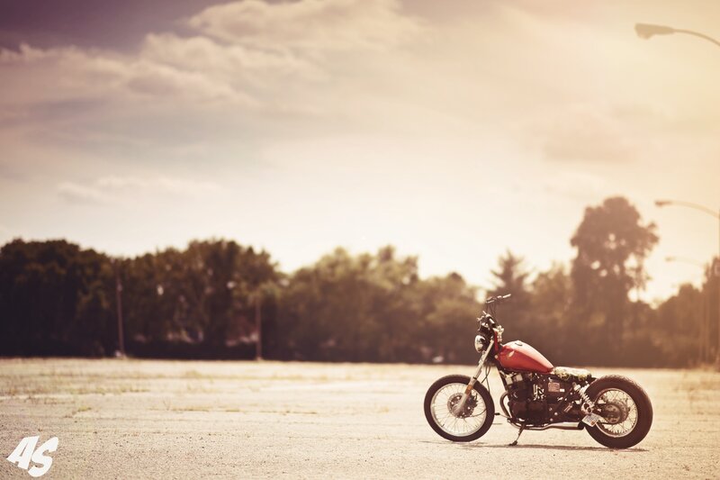 Red motorcycle in empty lot