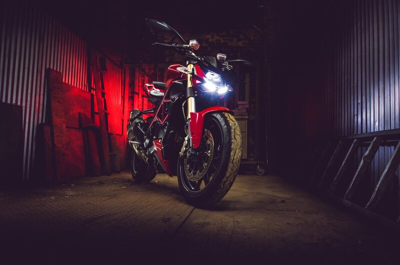 Red Motorcycle in Garage — Dramatic