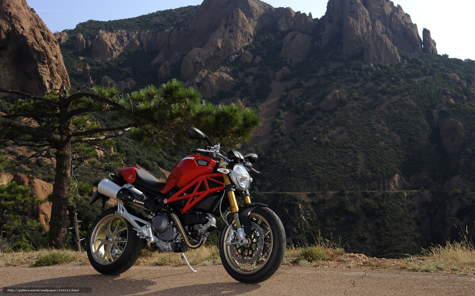 Red motorcycle in mountain landscape