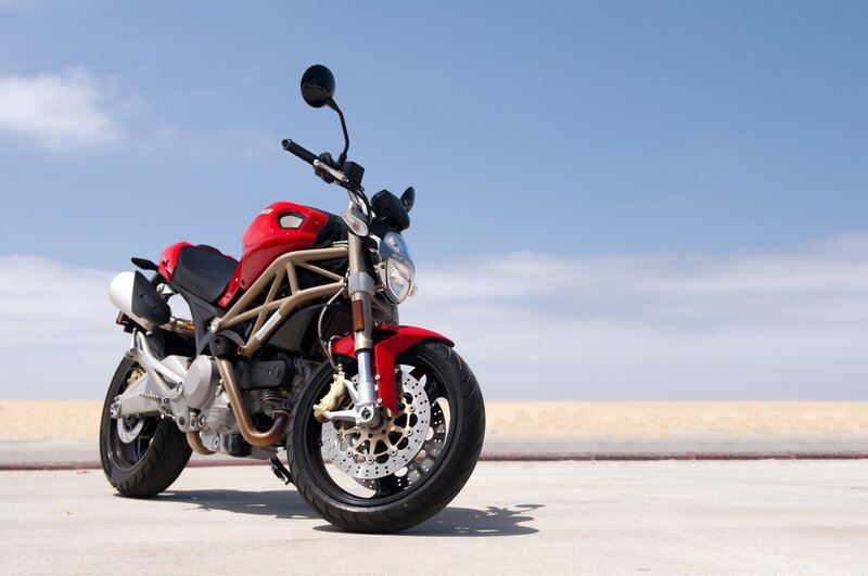 Red motorcycle on a beach