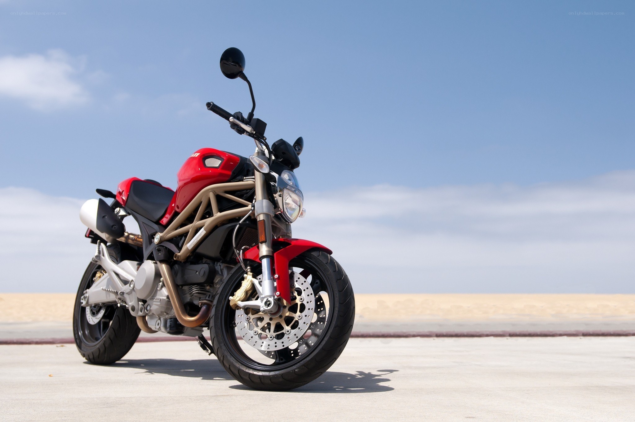 Red motorcycle on a beach
