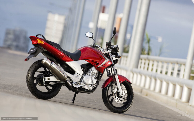 Red motorcycle on a bridge