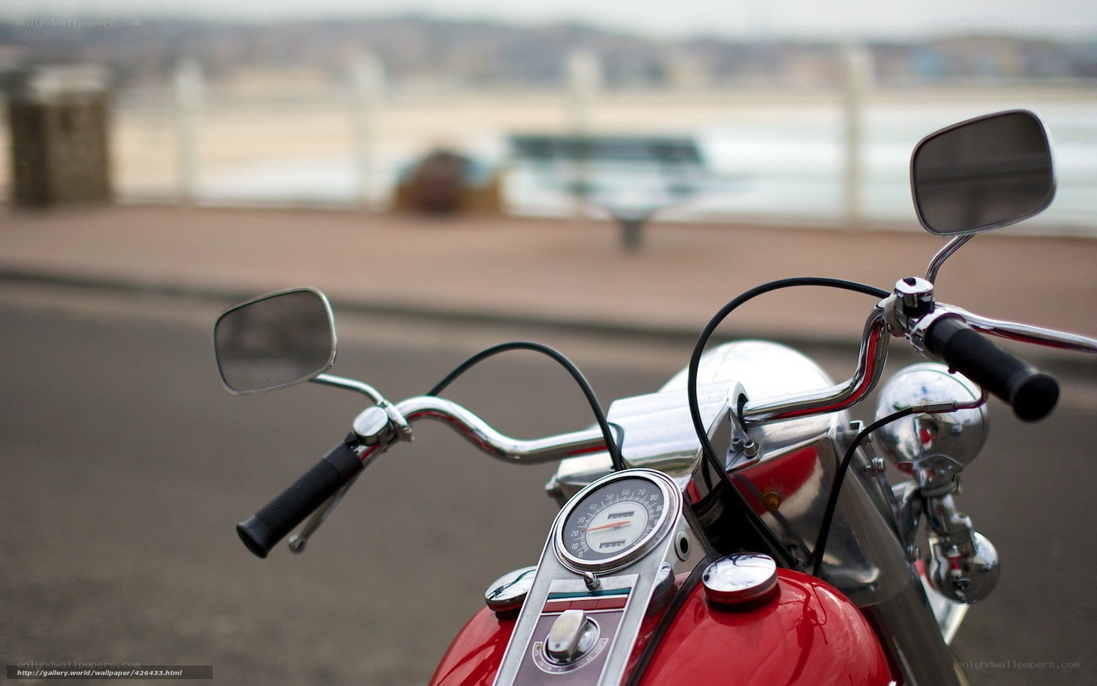 Red motorcycle on a promenade