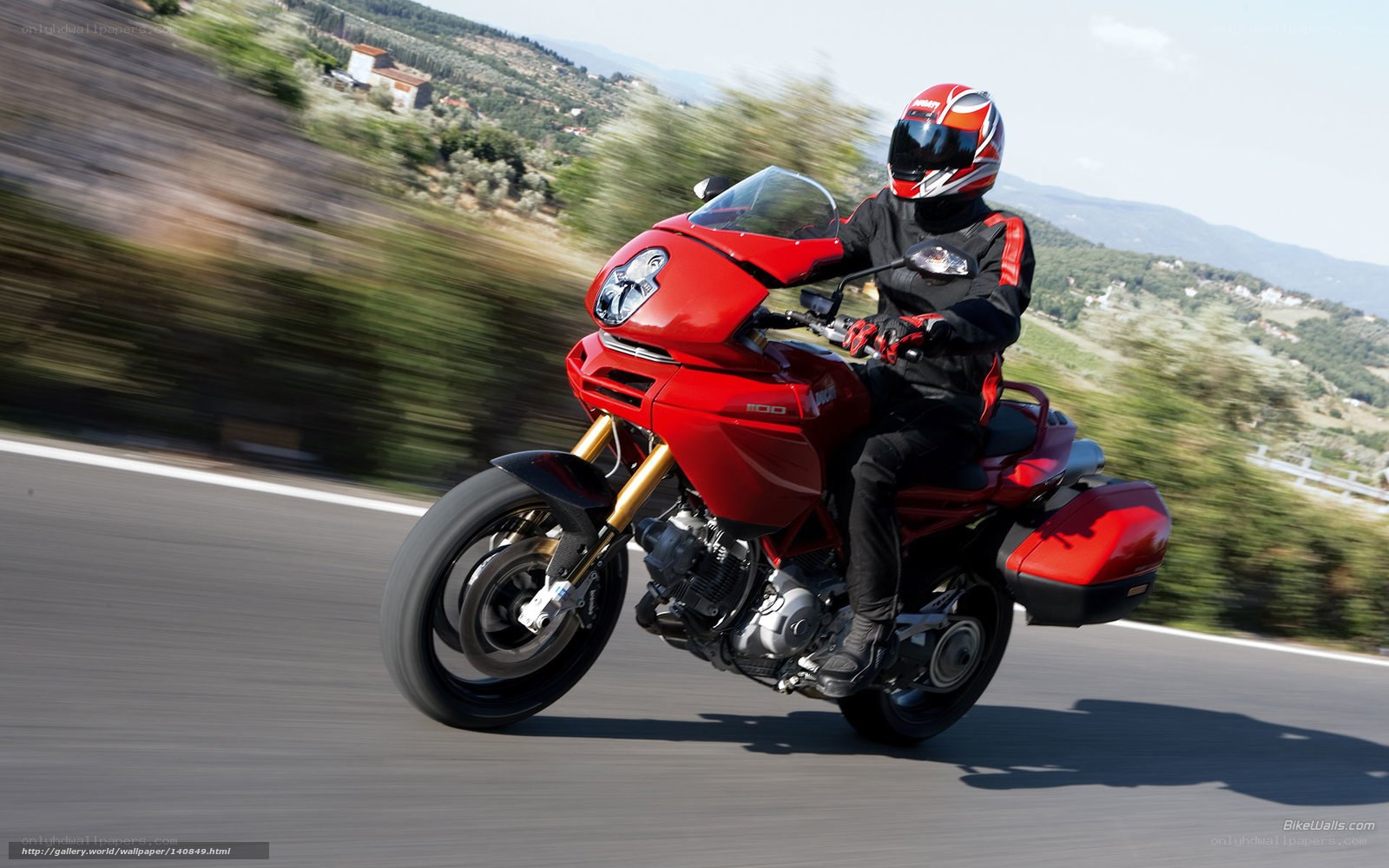 Red motorcycle on a scenic road