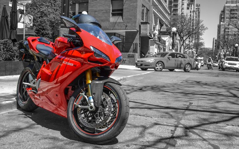 Red motorcycle on city street