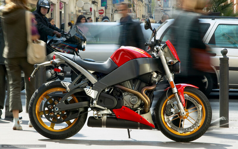 Red motorcycle on city street