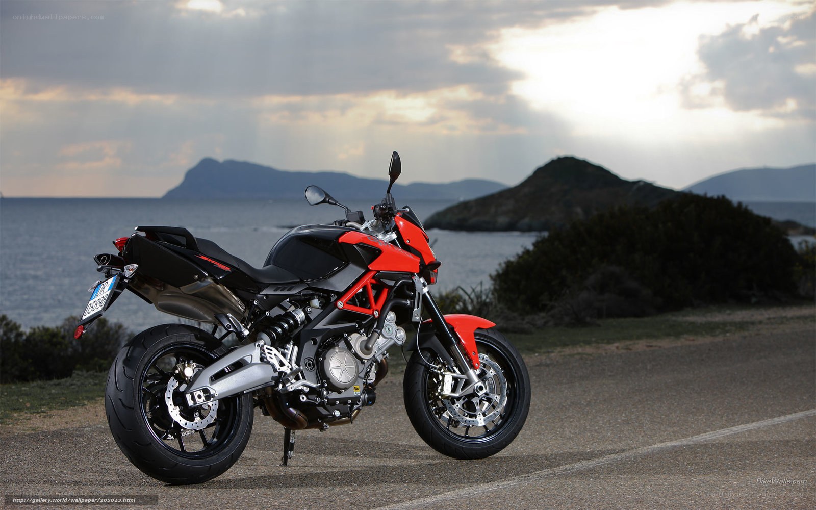Red motorcycle on coastal road