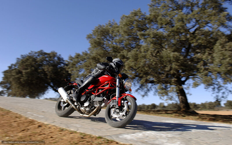 Red motorcycle on country road