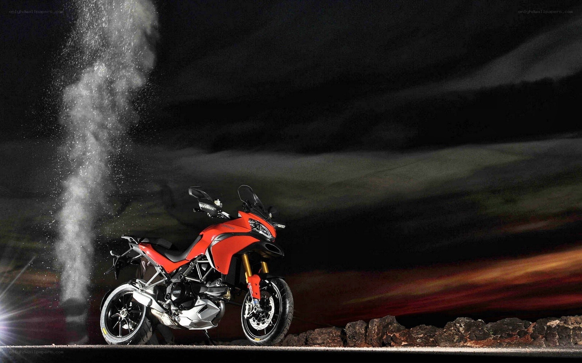 Red motorcycle on dark road