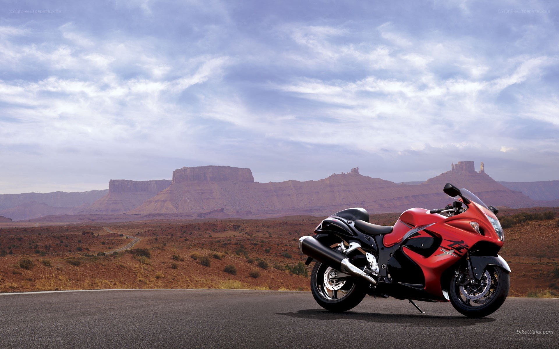 Red motorcycle on desert road