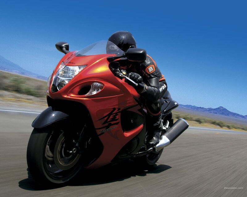 Red motorcycle on desert road