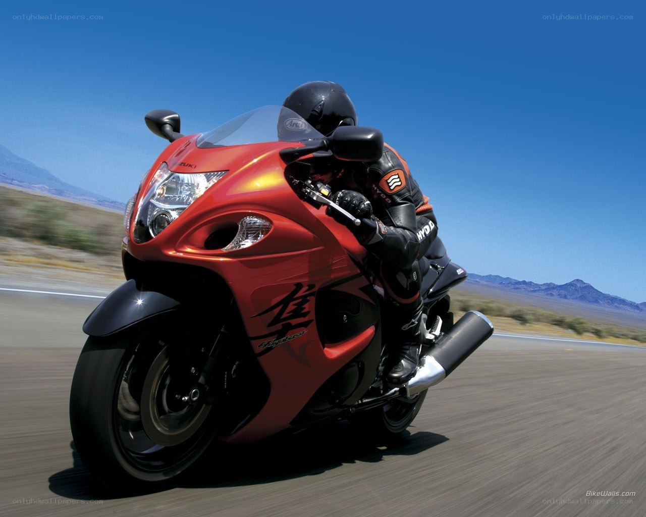 Red motorcycle on desert road