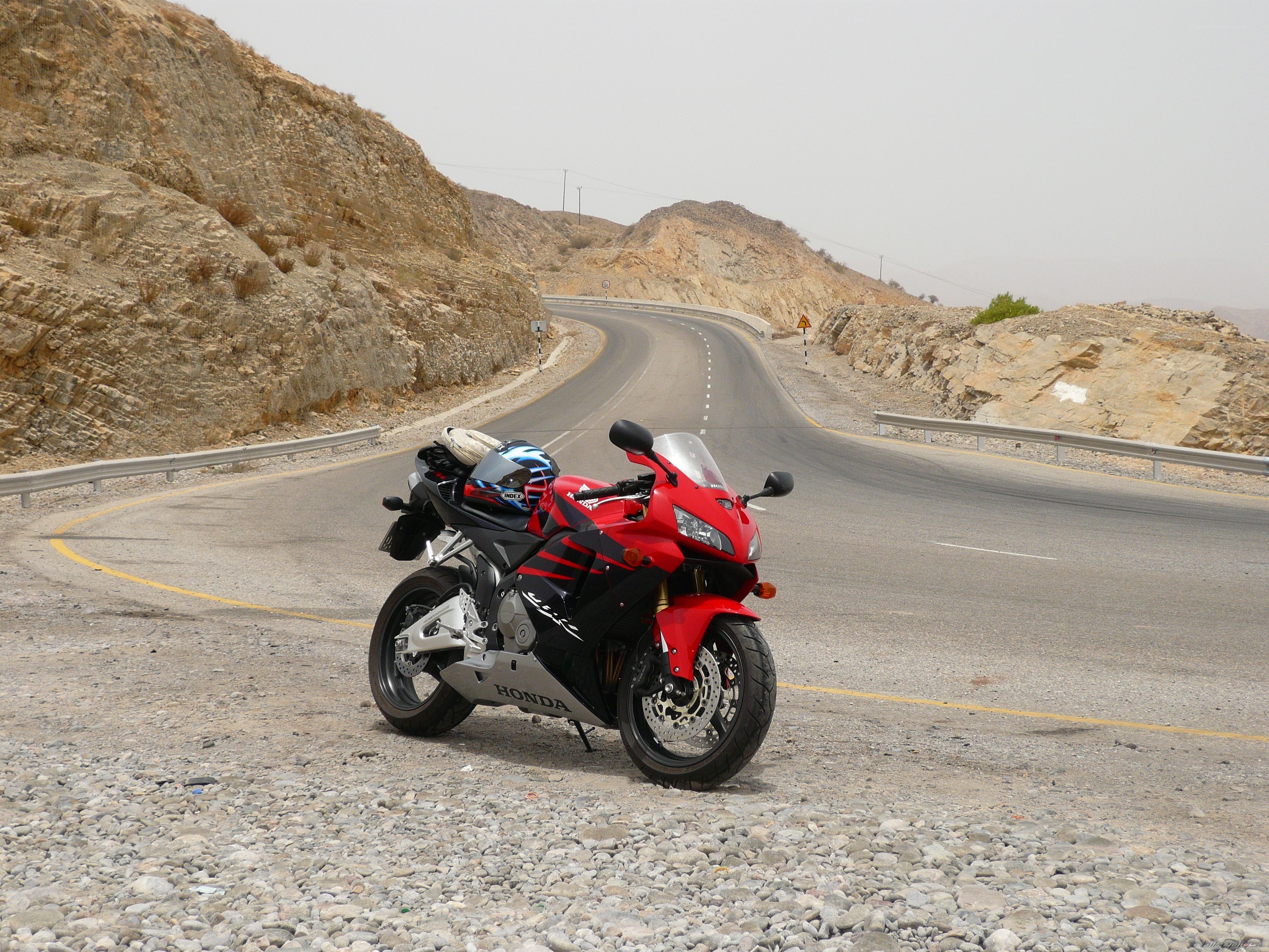 Red motorcycle on desert road