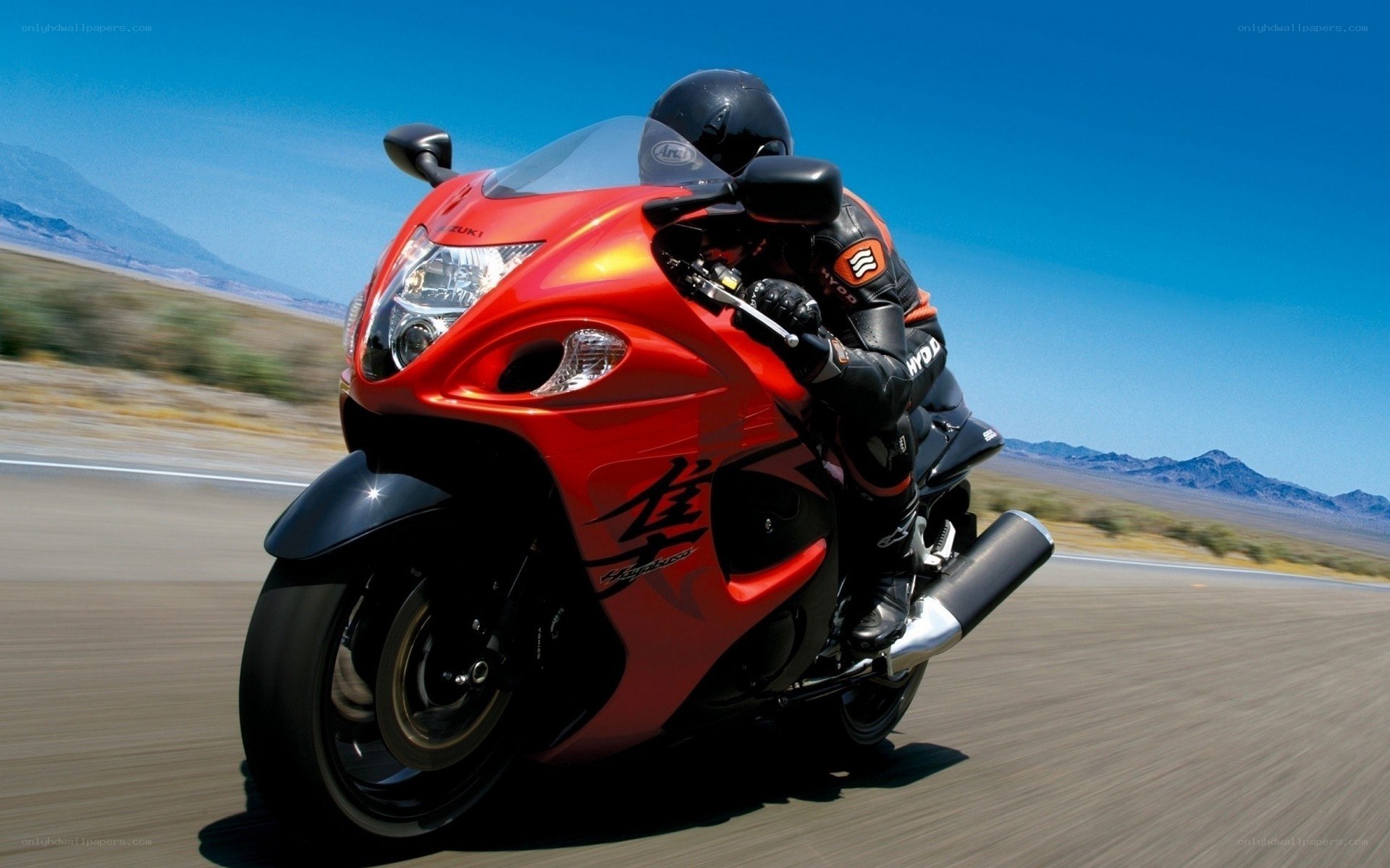 Red motorcycle on desert road
