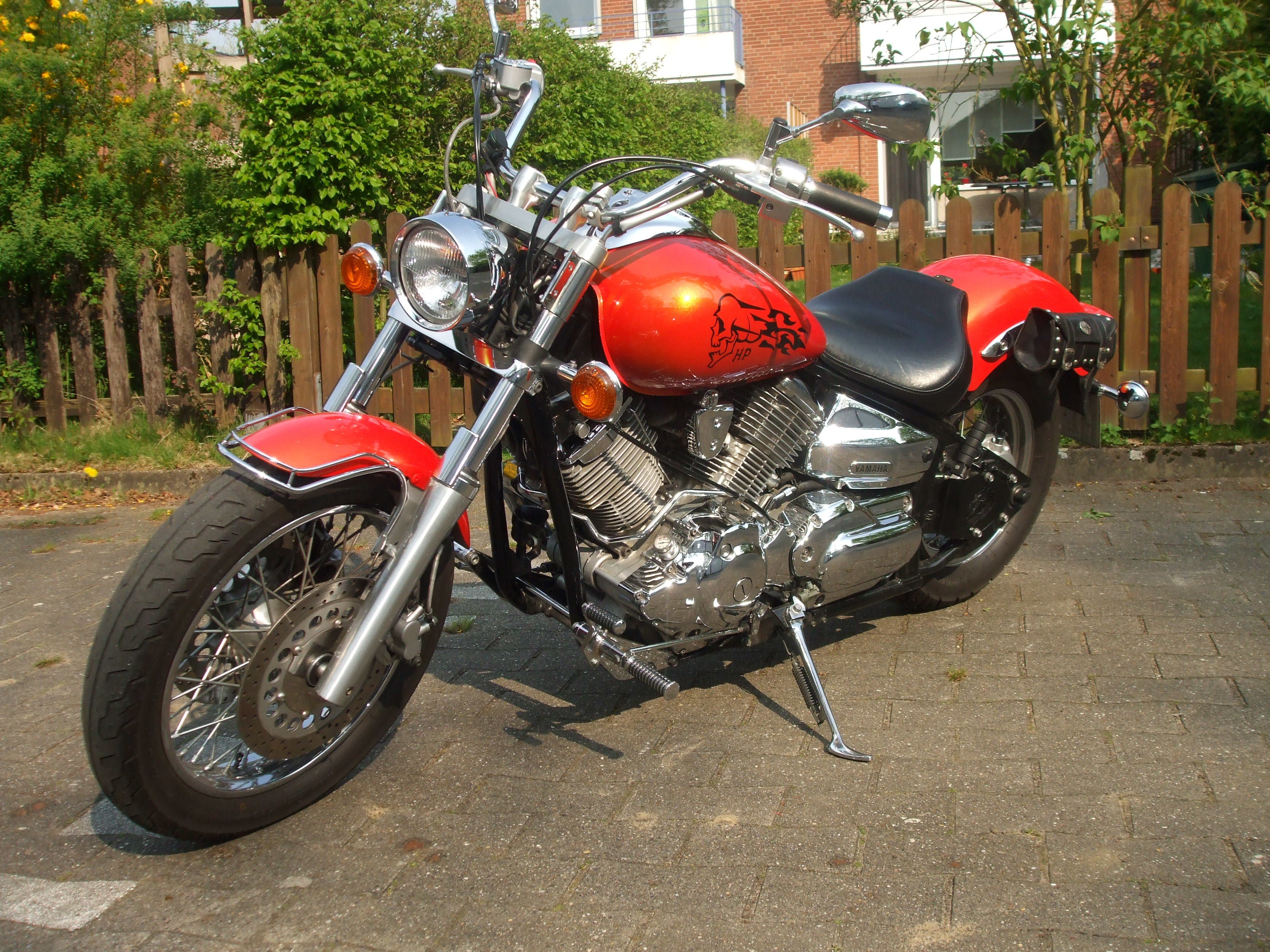 red motorcycle on driveway