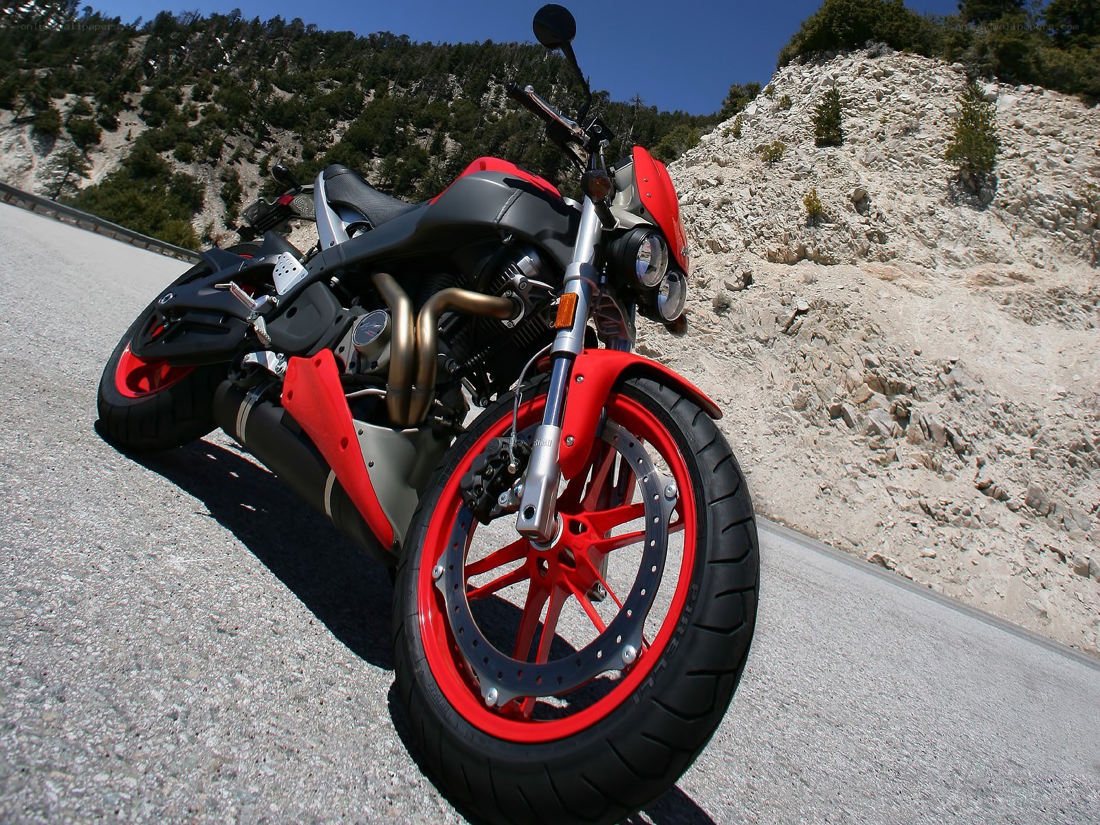 Red motorcycle on mountain road