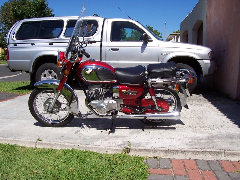 Red Motorcycle on Pavement — Calm
